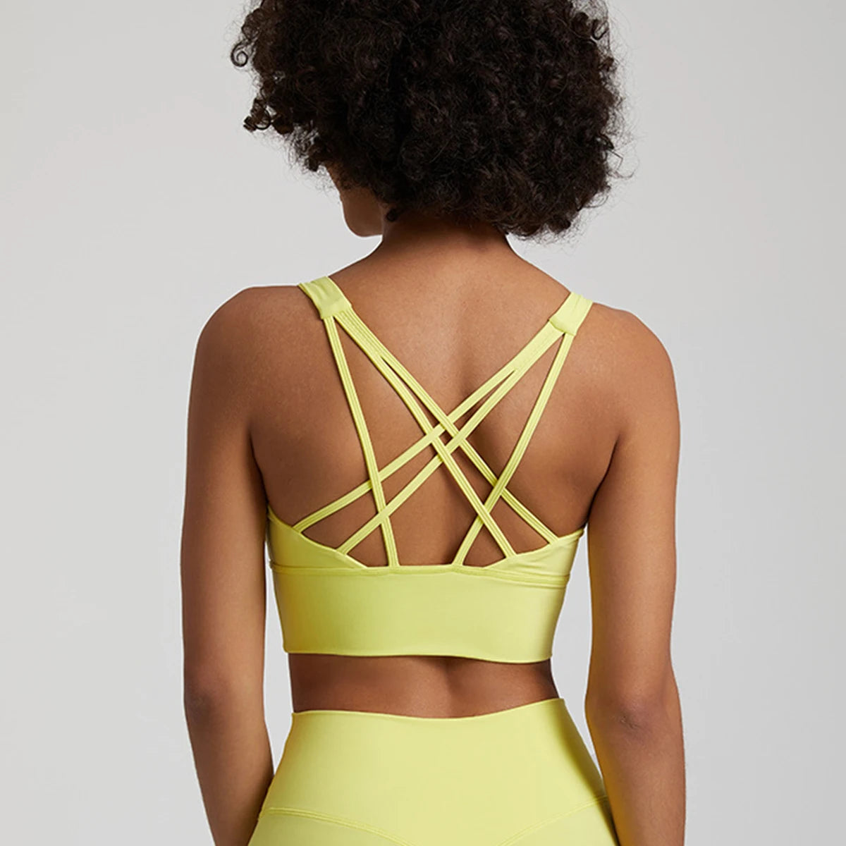 Back View of Lady in Our KeneChic Strappy Sport Bra